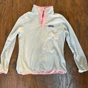 Grey and bright pink Patagonia women’s snap neck pullover